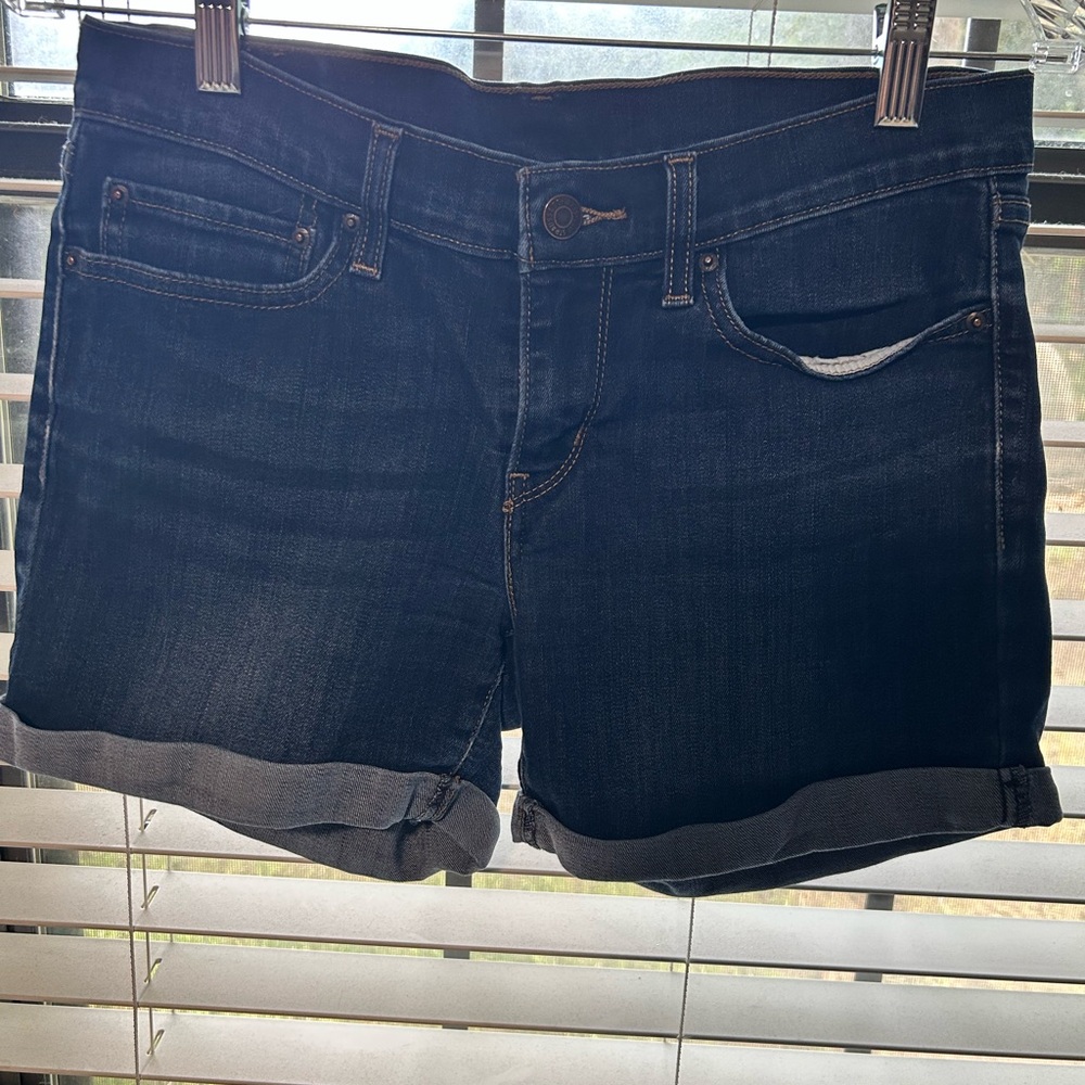 Levi's Blue Jean Shorts with Frayed Hem and Mid-Thigh Cut